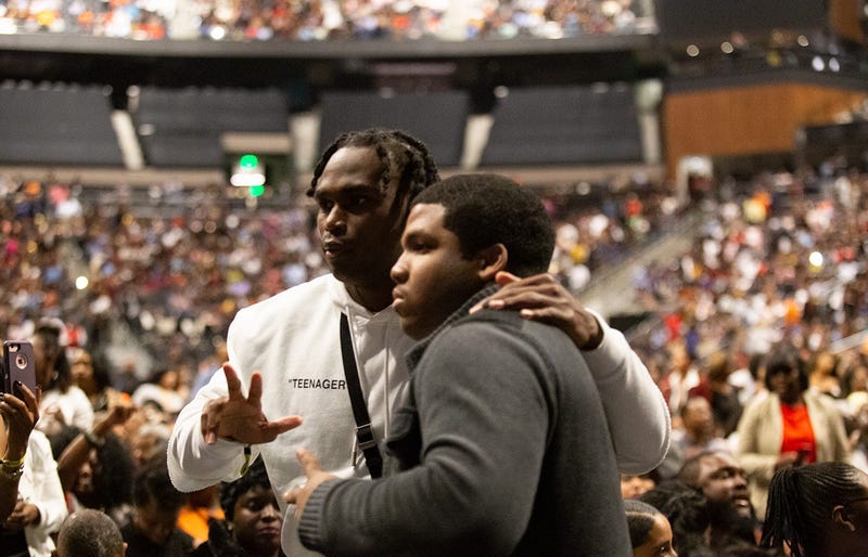 Atlanta Falcons player Julio Jones takes a photo with a fan at V-103 LIVE on Saturday, March 30, 2019, at State Farm Arena in Atlanta
