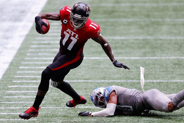 Falcons WR Julio Jones breaks a tackle