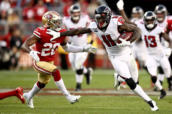 Falcons WR Julio Jones delivers a stiff arm