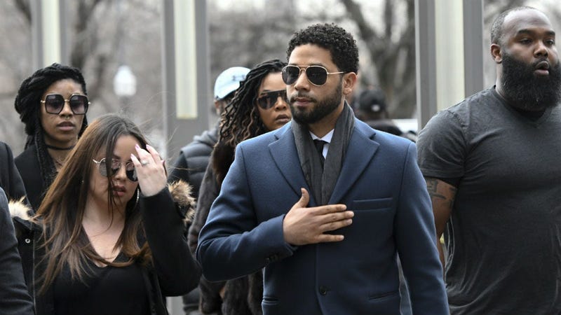 Empire actor Jussie Smollett, center, arrives at the Leighton Criminal Court Building for his hearing on Thursday, March 14, 2019, in Chicago.