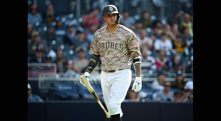 MAY 19: Manny Machado #13 of the San Diego Padres walks back to the dugout after striking out in the ninth inning against the Pittsburgh Pirates at Petco Park May 19, 2019 in San Diego, California. (Photo by Denis Poroy/Getty Images)