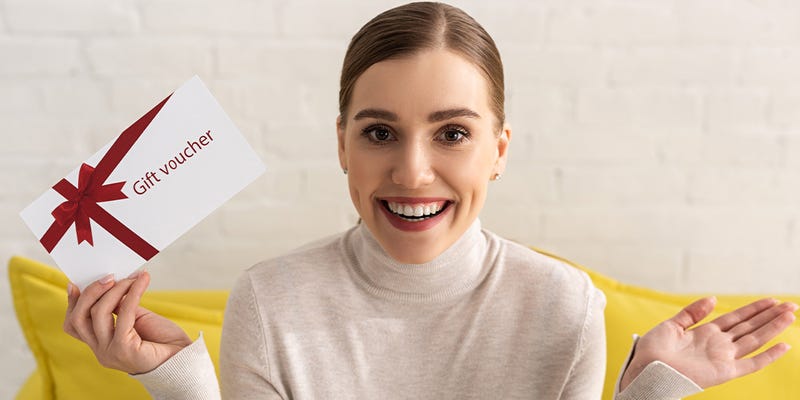 Woman holding a gift card