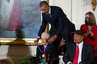 FILE - In this Nov. 24, 2015 photo, Willie Mays, right, looks on as President Barack Obama presents the Presidential Medal of Freedom to NASA mathematician Katherine Johnson during a ceremony at the White House. (AP Photo/Evan Vucci, File)