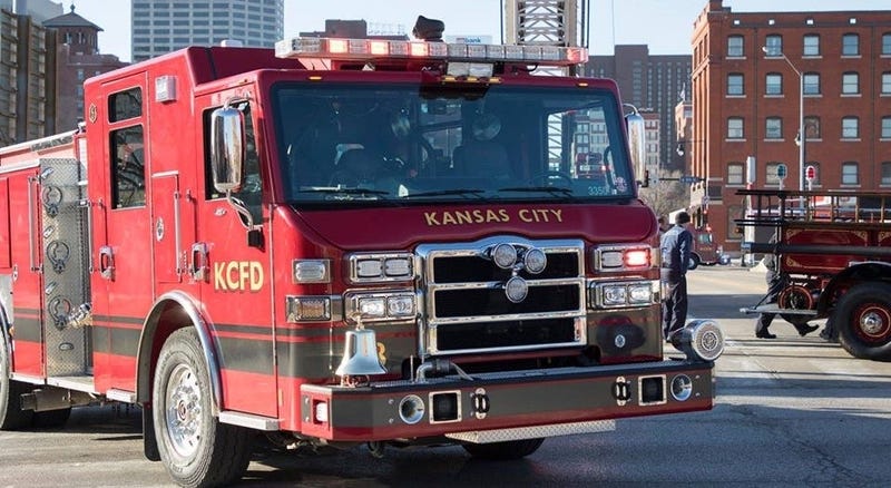 A KCFD firetruck rolls through downtown Kansas City