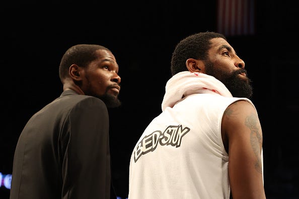 Kevin Durant and Kyrie Irving before a Brooklyn Nets game.