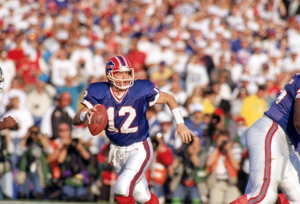 Jim Kelly drops back to pass in Super Bowl XXVII. 