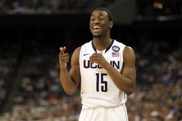 Kemba Walker smiles during a UConn game.