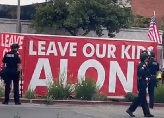 giant sign that says leave our kids alone
