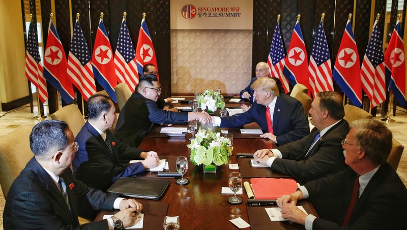 Top leader of the Democratic People's Republic of Korea Kim Jong Un (3rd L) holds talks with U.S. President Donald Trump in Singapore, on June 12, 2018.