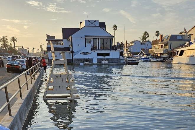 high tides lead to flooding near road
