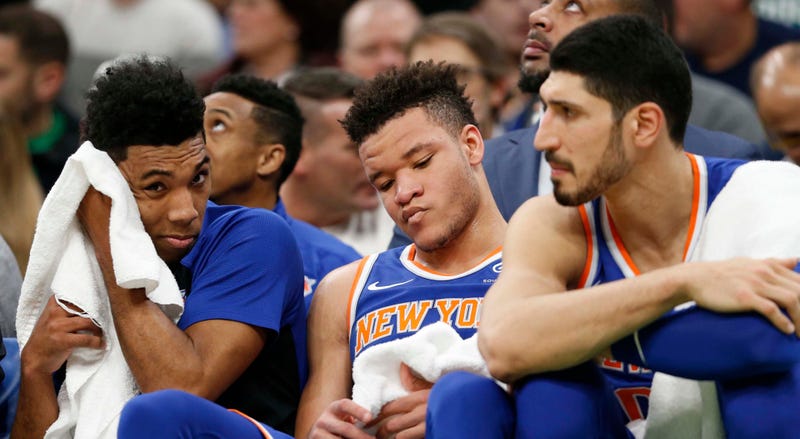 Dec 6, 2018; Boston, MA, USA; Knicks guard Allonzo Trier (14), forward Kevin Knox (20) and center Enes Kanter (0) react on the bench late in the second half against the Boston Celtics at TD Garden. Mandatory Credit: Greg M. Cooper-USA TODAY Sports