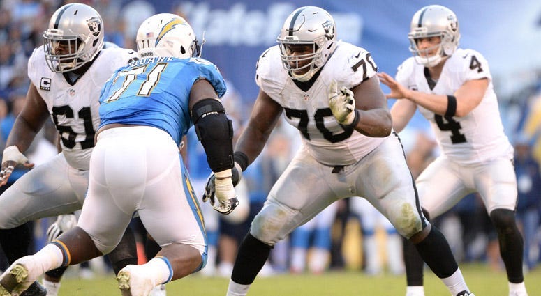 Raiders offensive guard Kelechi Osemele (70) blocks Chargers defensive tackle Damion Square on Dec. 18, 2016, at Qualcomm Stadium in San Diego.