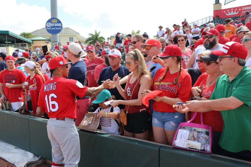 Kolten Wong signs autographs. 