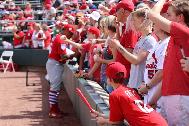 Kolten Wong signs autographs. 