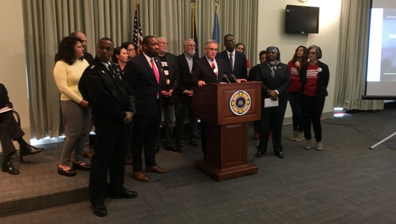 District Attorney Larry Krasner stands with City Council President Darrell Clarke and Police Commissioner Richard Ross