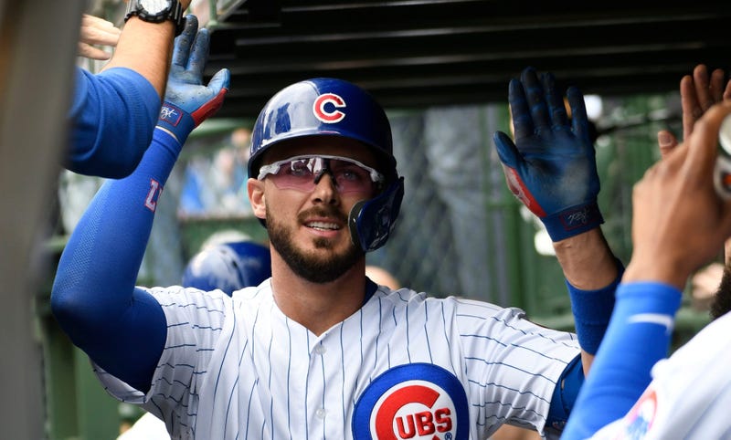 Kris Bryant celebrates with Cubs teammates after homering.