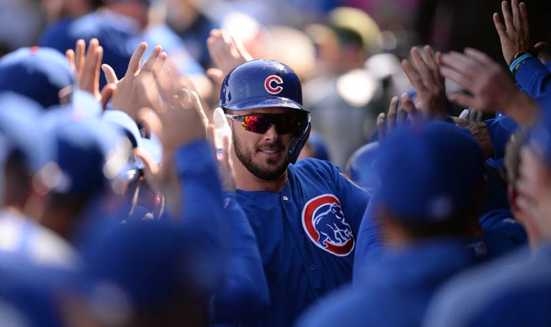 Kris Bryant is congratulated by Cubs teammates