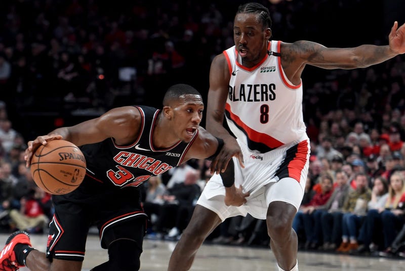 Bulls point guard Kris Dunn, left, drives to the hoop.