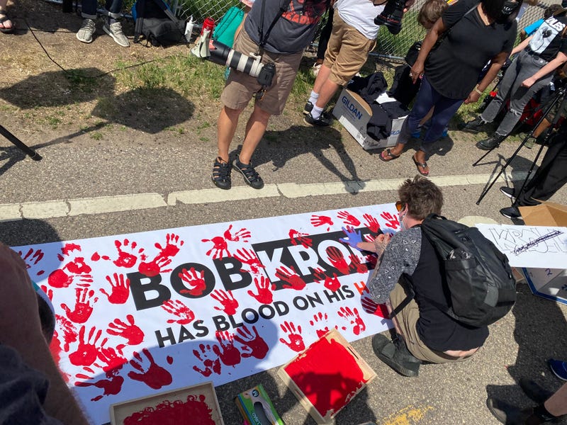 kroll protest banner