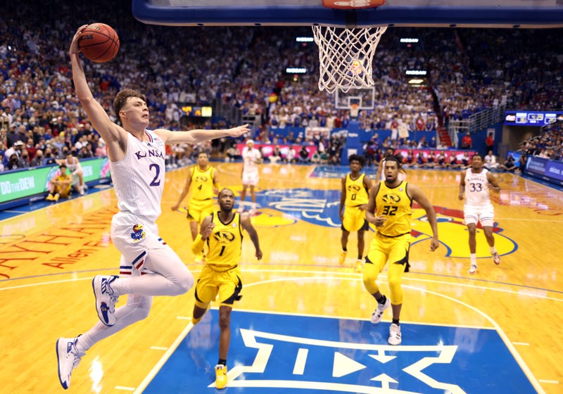 Christian Braun #2 of the Kansas Jayhawks scores on a fast break during the game against the Missouri Tigers at Allen Fieldhouse on December 11, 2021 in Lawrence, Kansas.