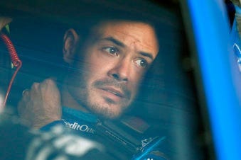 FILE - In this Oct. 18, 2019, file photo, Kyle Larson sits in his car before the final practice for a NASCAR Cup Series auto race at Kansas Speedway in Kansas City, Kan. (AP Photo/Colin E. Braley, File)