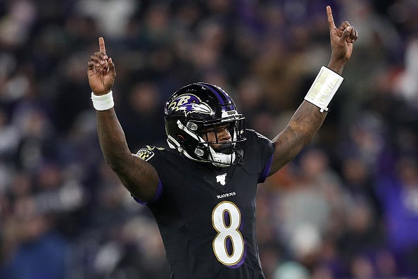 Lamar Jackson celebrates a TD pass for the Ravens. 