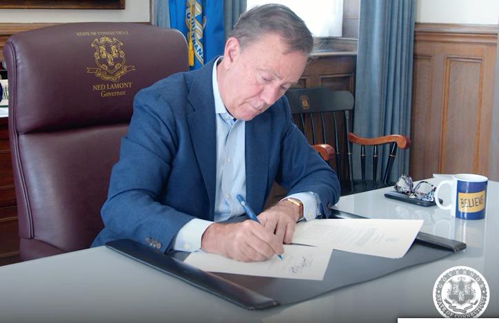 Gov. Ned Lamont signing the Reproductive Freedom Defense Act