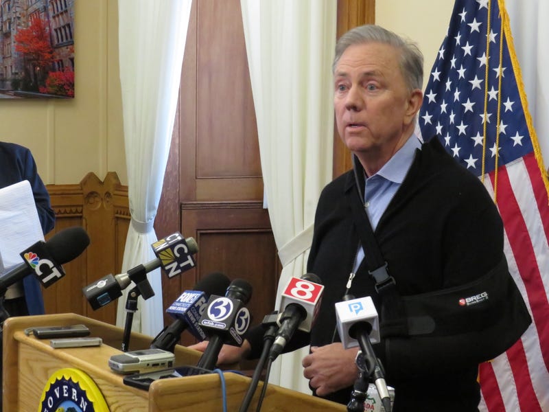 Gov. Ned Lamont (D-CT), his recently broken arm in a sling, addresses the media at the state Capitol, 3/3/25