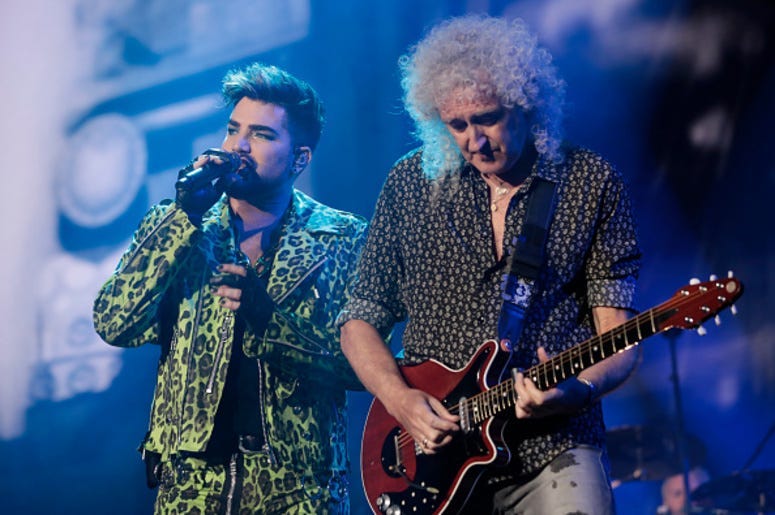Adam Lambert (L) performs with Brian May of Queen during Fire Fight Australia at ANZ Stadium on February 16, 2020 in Sydney, Australia.