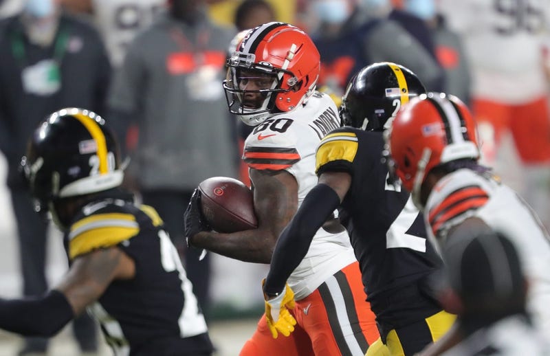 Cleveland Browns wide receiver Jarvis Landry eyes down Pittsburgh defenders as runs toward the end zone to score during the second half of an NFL wild-card playoff football game, Sunday, Jan. 10, 2021, in Pittsburgh, Pennsylvania.