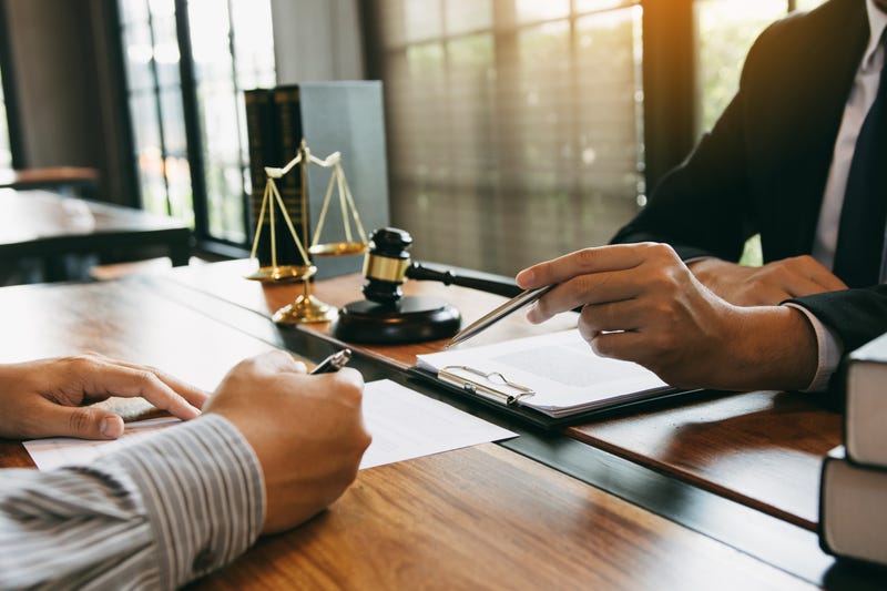 Lawyer is explaining law to a client at the office