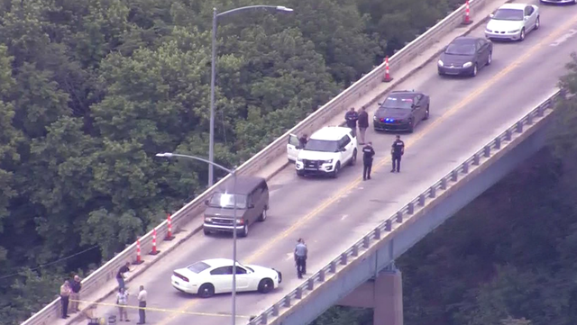 A helicopter view of a bridge in Leavenworth, KS where a gunman was stopped by an Army soldier by running over him.