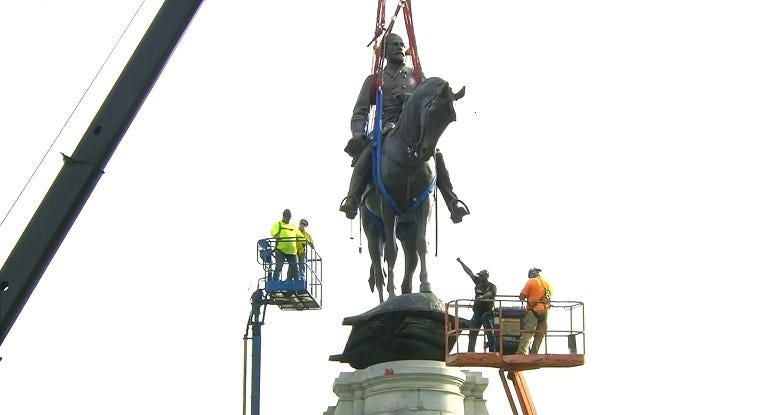 Lee Monument is removed from its pedestal.