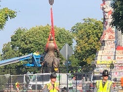 Robert E. Lee statue stands on ground for the first time in over 100 years.