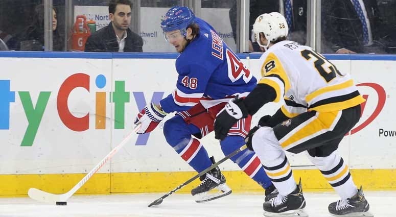 Rangers left wing Brendan Lemieux plays the puck against Penguins defenseman Marcus Pettersson on March 25, 2019, at Madison Square Garden.