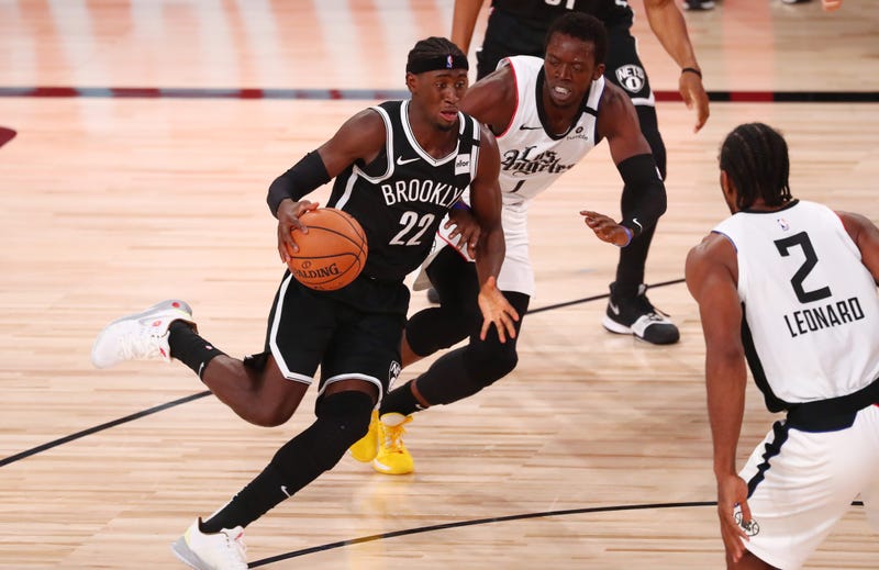 Nets guard Caris LeVert shoots over Hawks guard Marco Belinelli on Dec. 4, 2017, at Philips Arena in Atlanta.