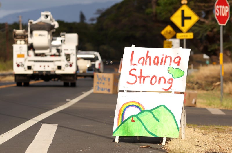 Lahaina roadside with 'Lahaina Strong' sign