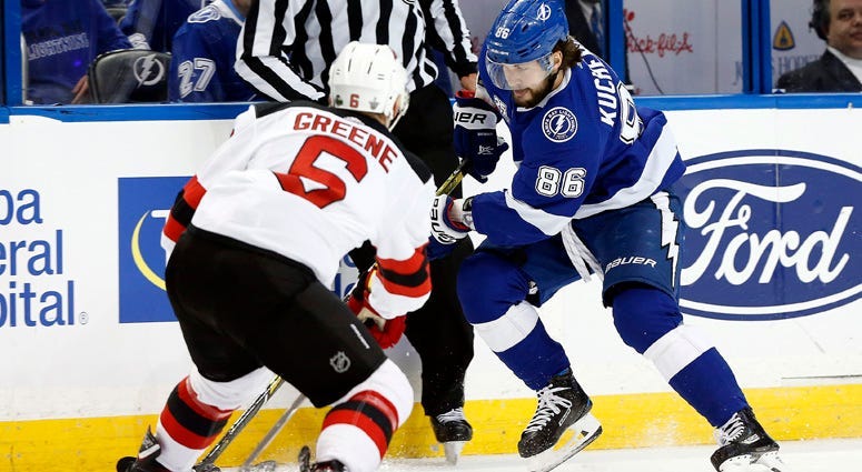 The Lightning's Nikita Kucherov skates with the puck as Devils defenseman Andy Greene (6) defends during Game 2 of their first-round playoff series on April 14, 2018, at Amalie Arena in Tampa, Florida.