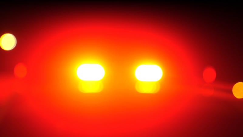 Blurred police car emergency vehicle lights in night street - stock photo