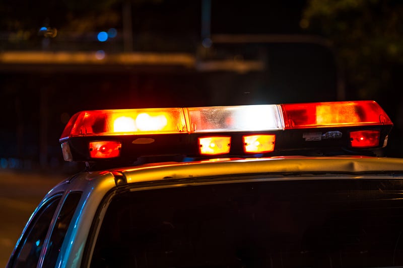 Emergency light, Red light flasher atop of a police car at night