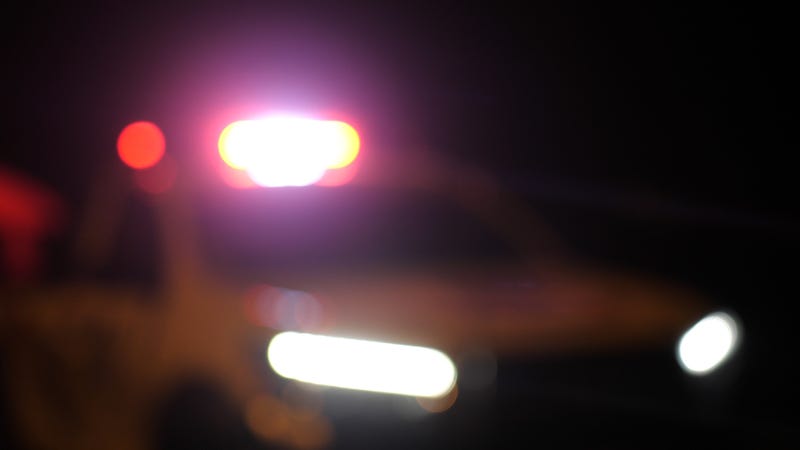 Blurred police car emergency vehicle lights in a night street