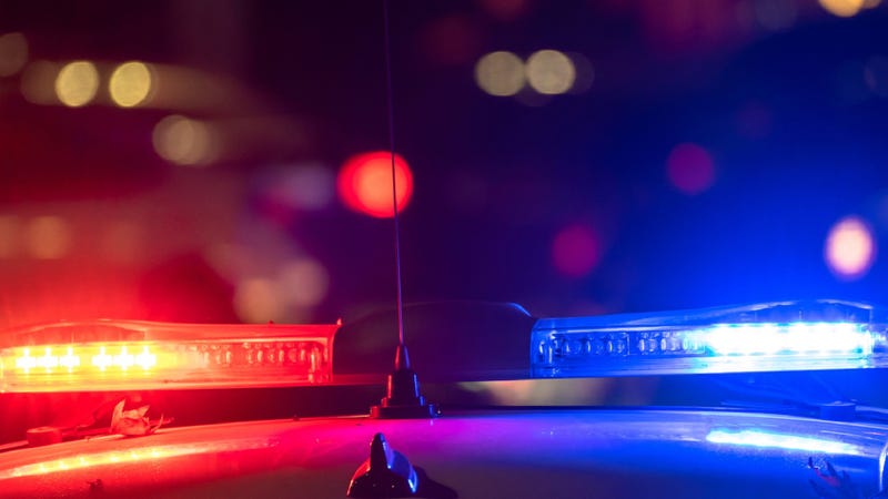 Police car with flashing lights on - stock photo