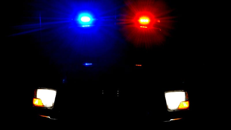 Flashing police lights at night - stock photo
