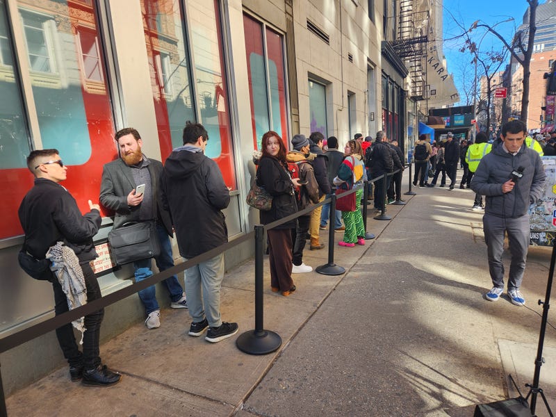Customers wait in line ahead of USTA's grand opening on Monday.