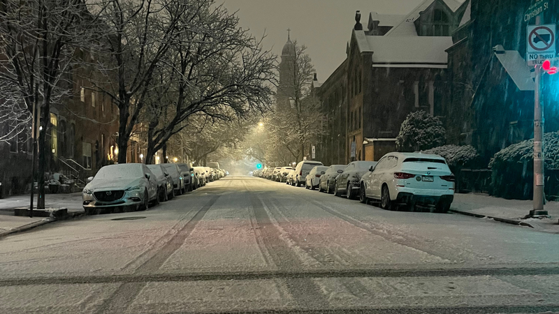 Snow coats the ground along 21st and Christian streets 