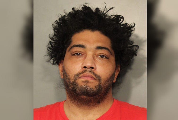 John Harvey, 38, is accused of pulling a knife during a parking dispute.