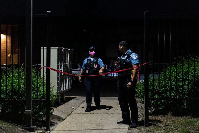 Chicago police investigate the scene where multiple people were shot, including a 9-year-old girl, June 17, 2020, in Gresham. 