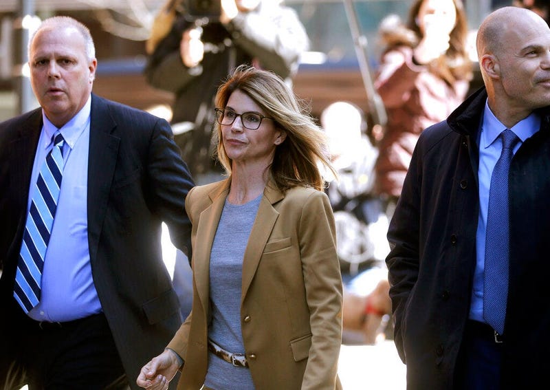 Actress Lori Loughlin arrives at federal court in Boston to face charges in a nationwide college admissions bribery scandal.