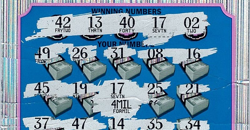 Scratched off lottery ticket showing two matching "17" for the $4 million prize 