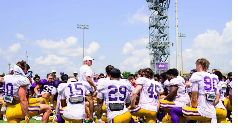 LSU coach Brian Kelly addresses the team during fall camp